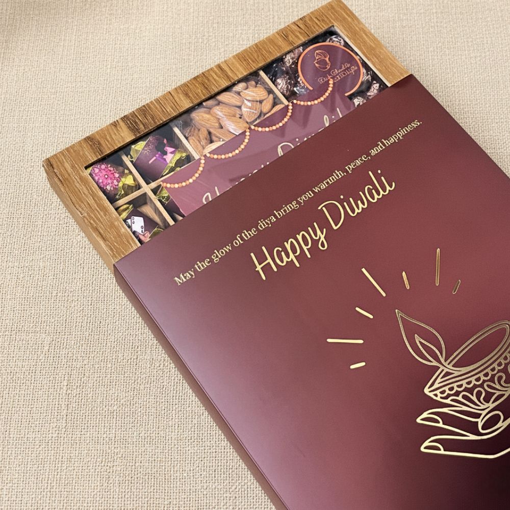 Diwali-Themed Wooden Gift Box with Nuts, Chocolates, Candles and Diwali Sleeve - 650g