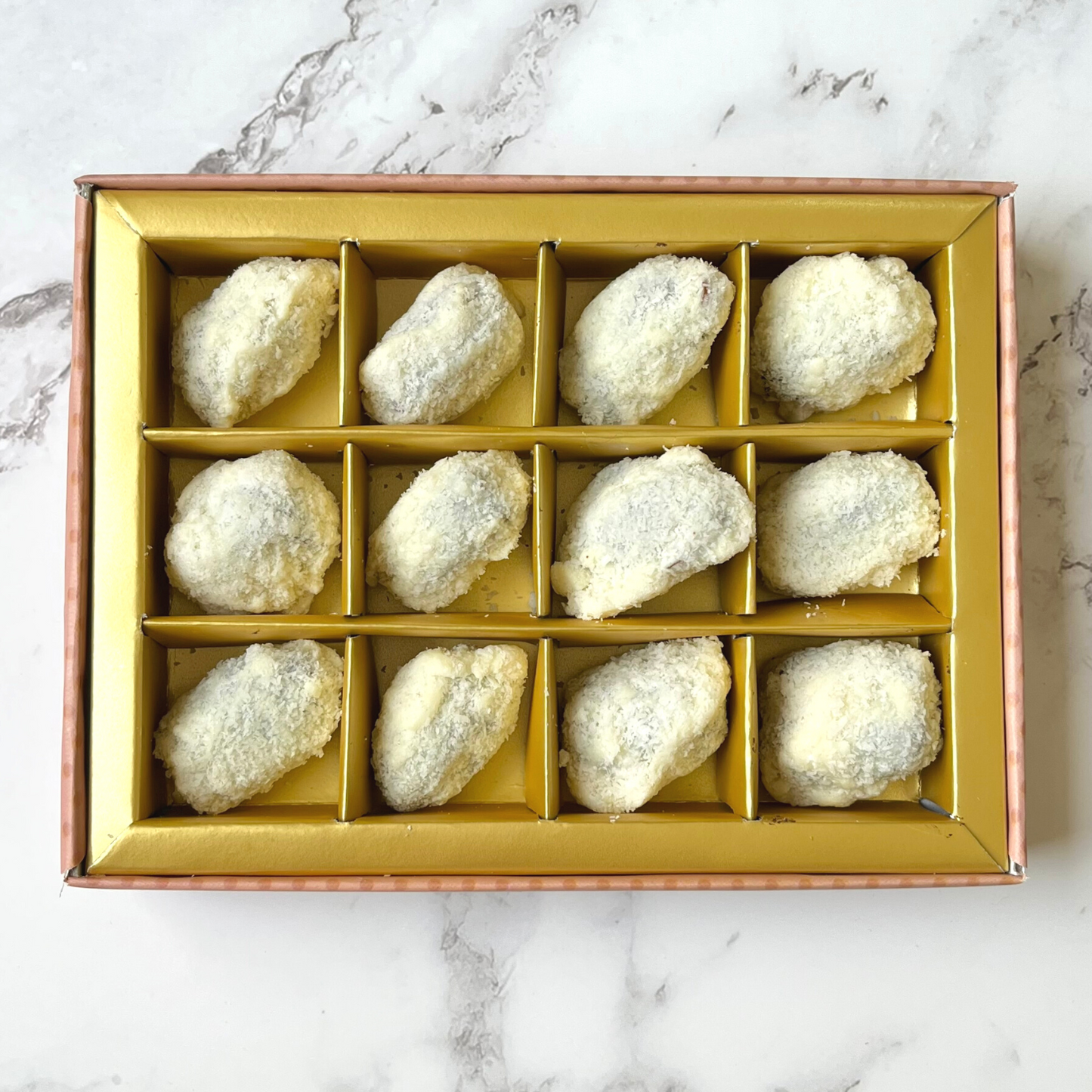 White Chocolate Coated Dates with Stuffed Almonds Covered in Coconut Shreds - 12 Foil-Wrapped Pieces